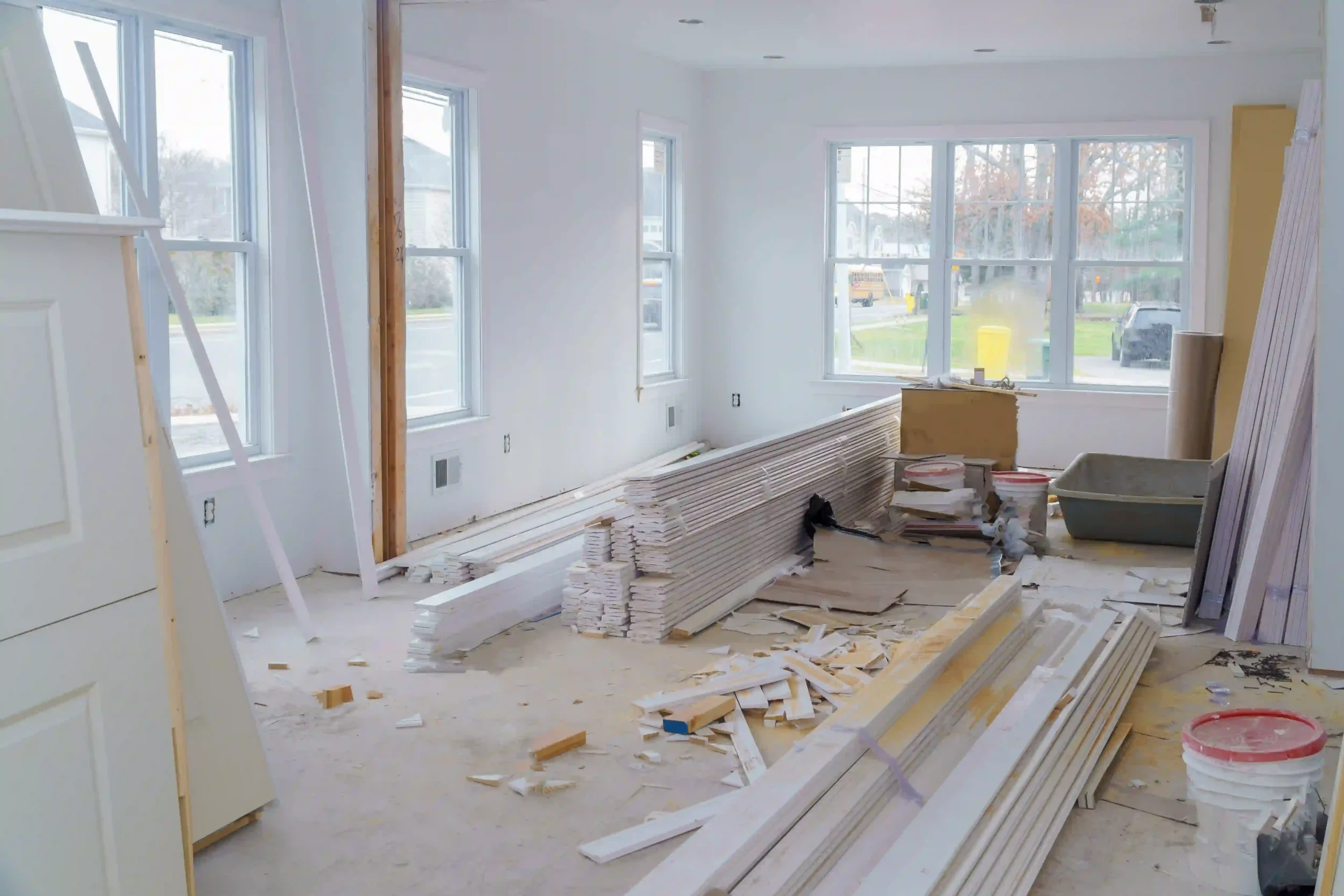 Home Renovation Services Illawarra in progress, showing an interior renovation with framing, drywall, and construction materials preparing for a modern home transformation.